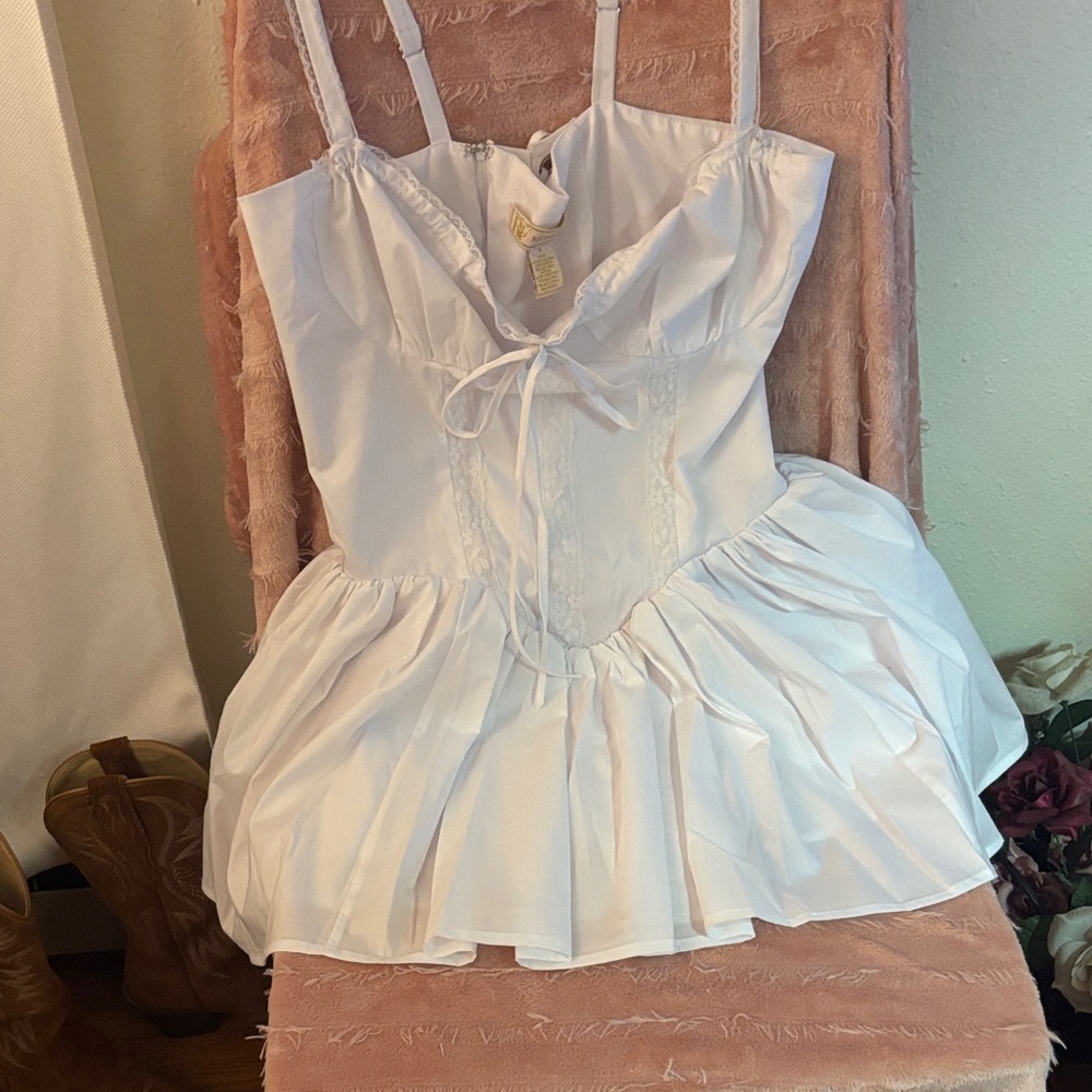 White Sleeveless Dress with Ruffle Skirt